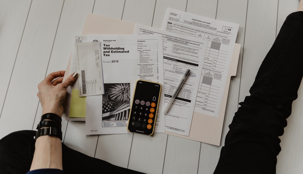 Couple reviewing financial documents and bills together at a desk